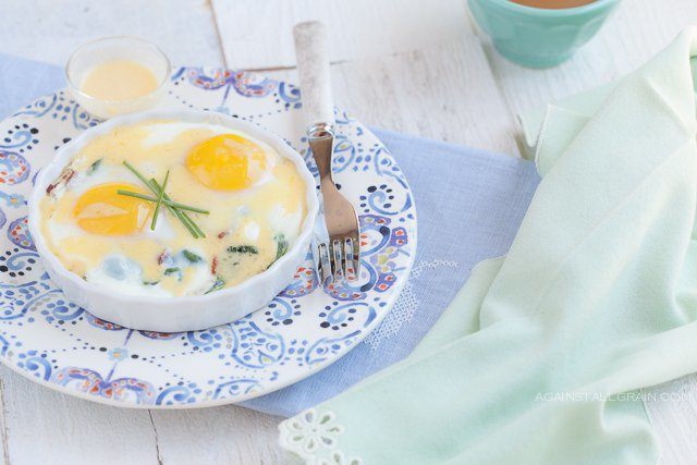 Baked Eggs with Bacon, Greens,and Hollandaise