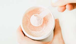 Collagen protein powder supplement in scoop for beauty skin and bones.